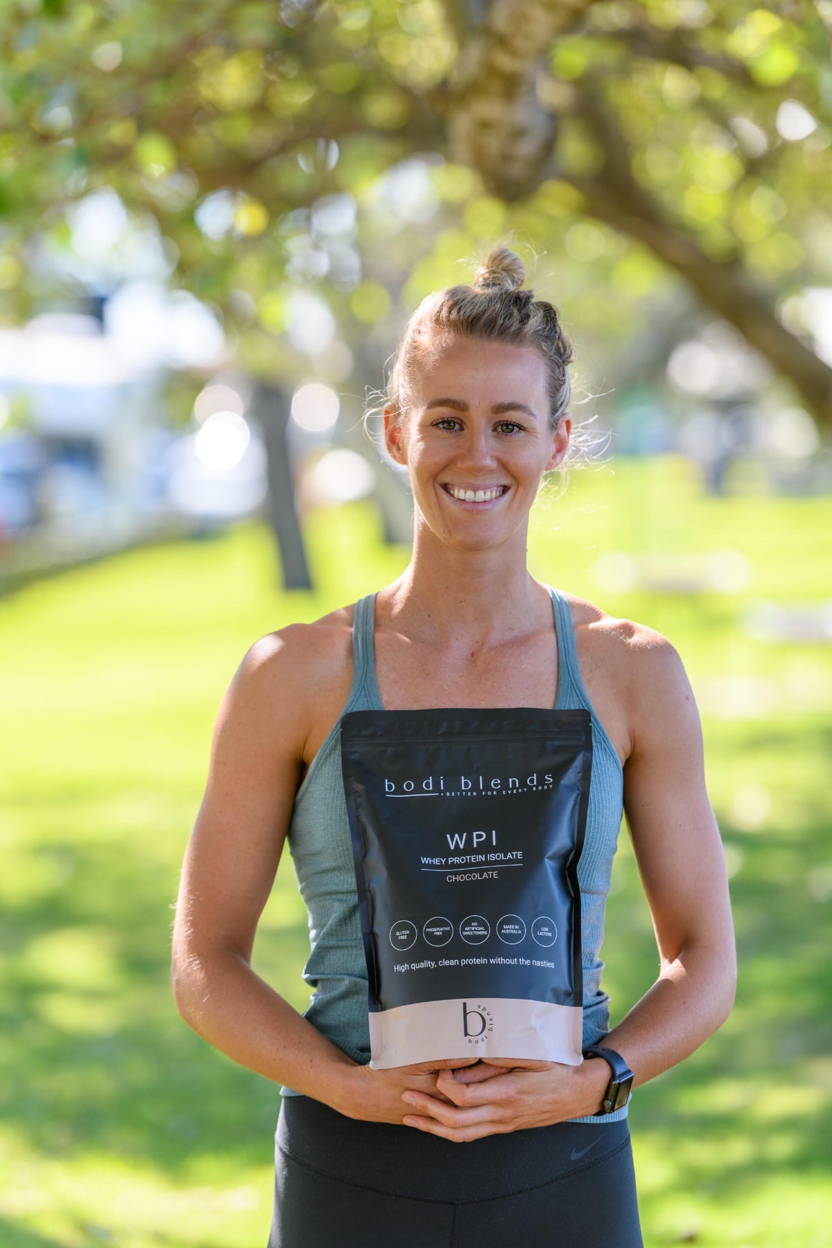 Female holding protein powder