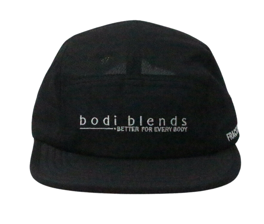 Front panel of a black hat with a white Bodi Blends logo stitched into the front. The cap is made of 100% recycled polyester.