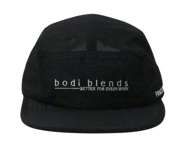 Front panel of a black hat with a white Bodi Blends logo stitched into the front. The cap is made of 100% recycled polyester.