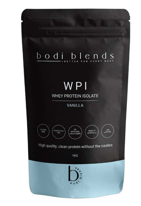 Front of a stand up pouch of vanilla flavoured whey protein isolate powder. The label shows the brand name, product name, size and some nutritional information. The powder is in a resealable, black plastic stand up pouch with a blue strip along the bottom.