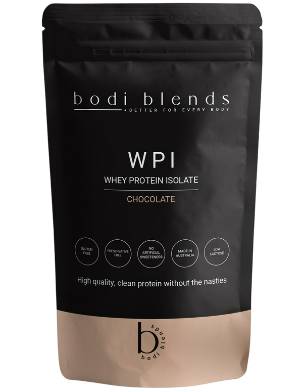 Front of a stand up pouch of chocolate flavoured whey protein isolate powder. The label shows the brand name, product name, size and some nutritional information. The powder is in a resealable, black plastic stand up pouch with a brown strip along the bottom.